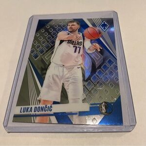 Luka Dončić 2023-24 Phoenix Panini Basketball Card White Laser #157